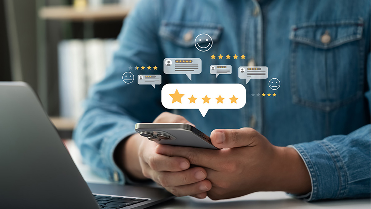 Person holding smartphone with floating star ratings and review icons, representing online credibility, trust signals, and customer testimonials for SEO