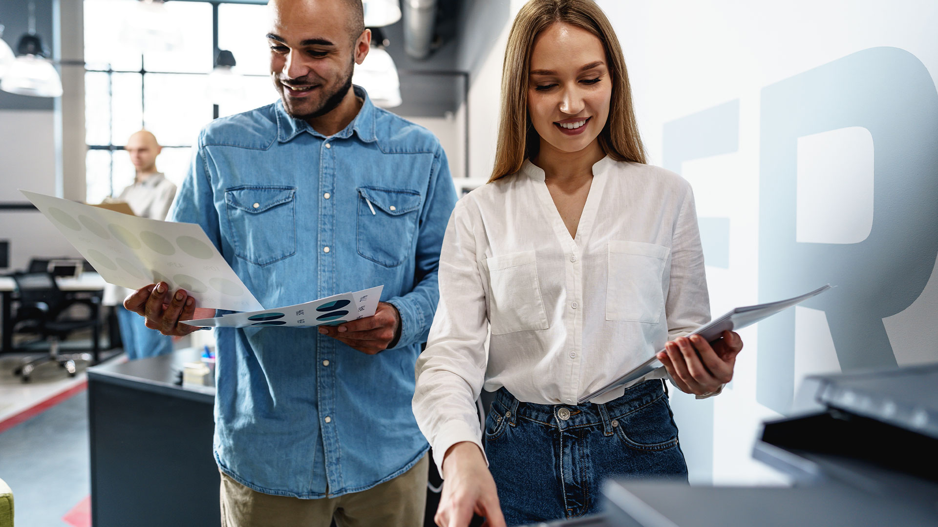 Office workers using Epson multifunction printer for color print materials in modern business environment