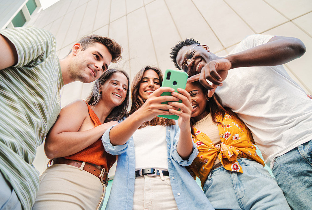 Group of editors sitting in a circle of chairs discussing edits for a state press submitted article.