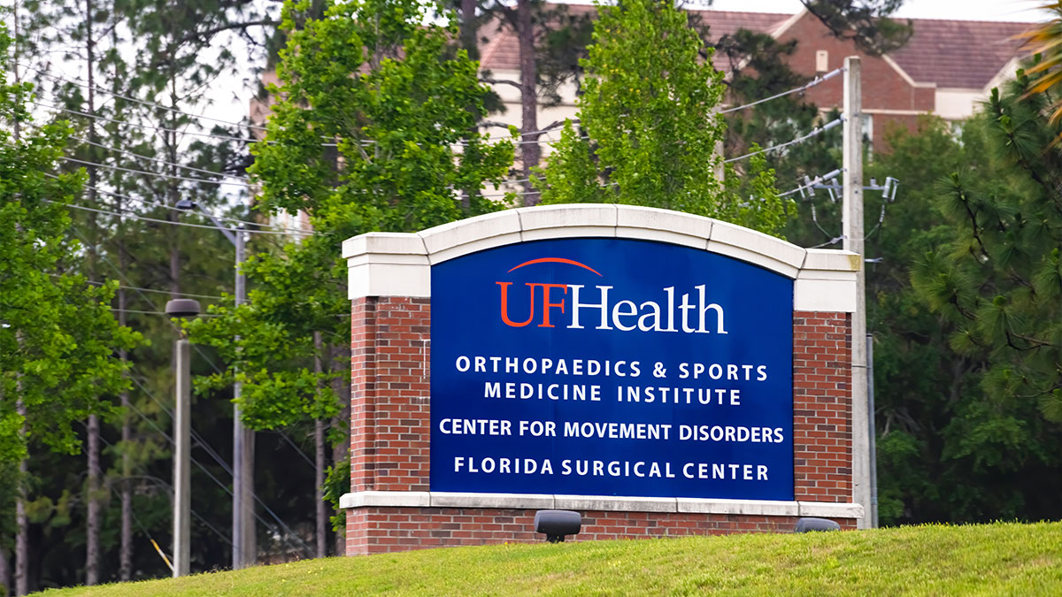 University of Florida health service sign for hospital of Orthopaedics and sports medicine medical institute, center for movement disorders on campus grounds